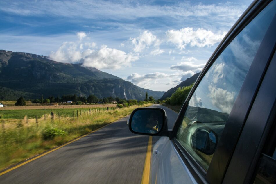 Side view of a car on a sunny highway