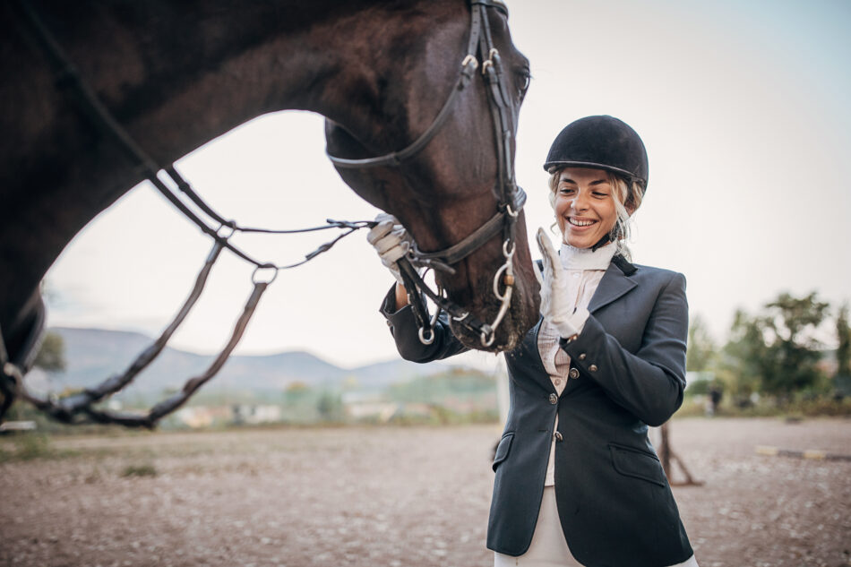 One woman, beautiful young woman horse rider and her horse.