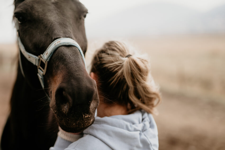 Young woman with horse