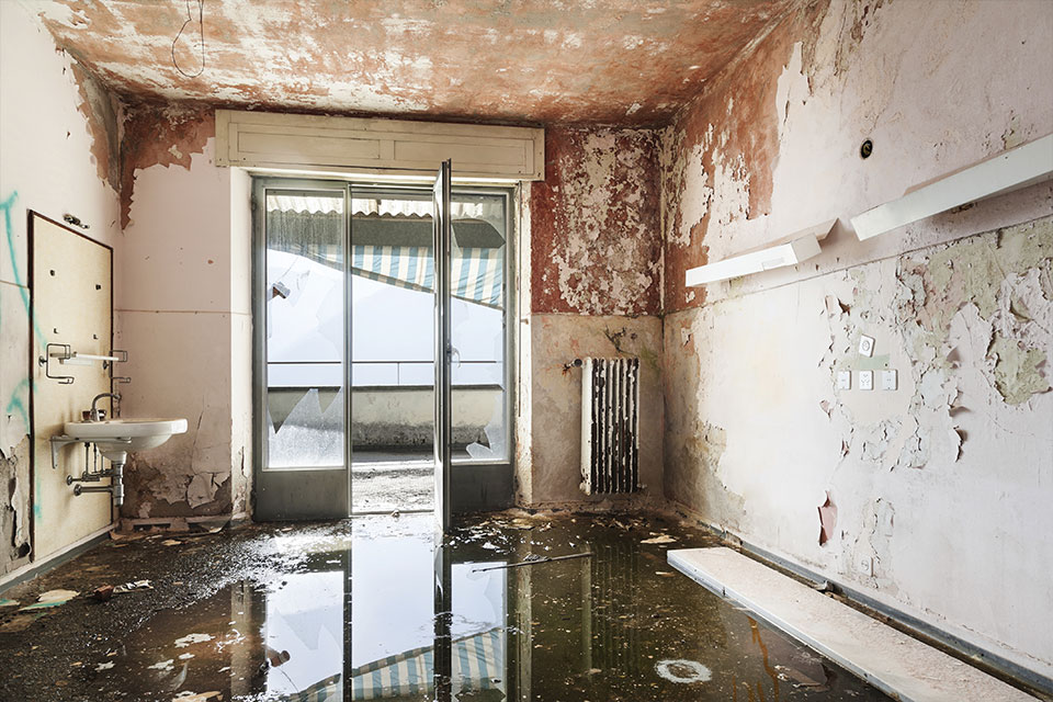 Photo of room with severe water damage and flooding